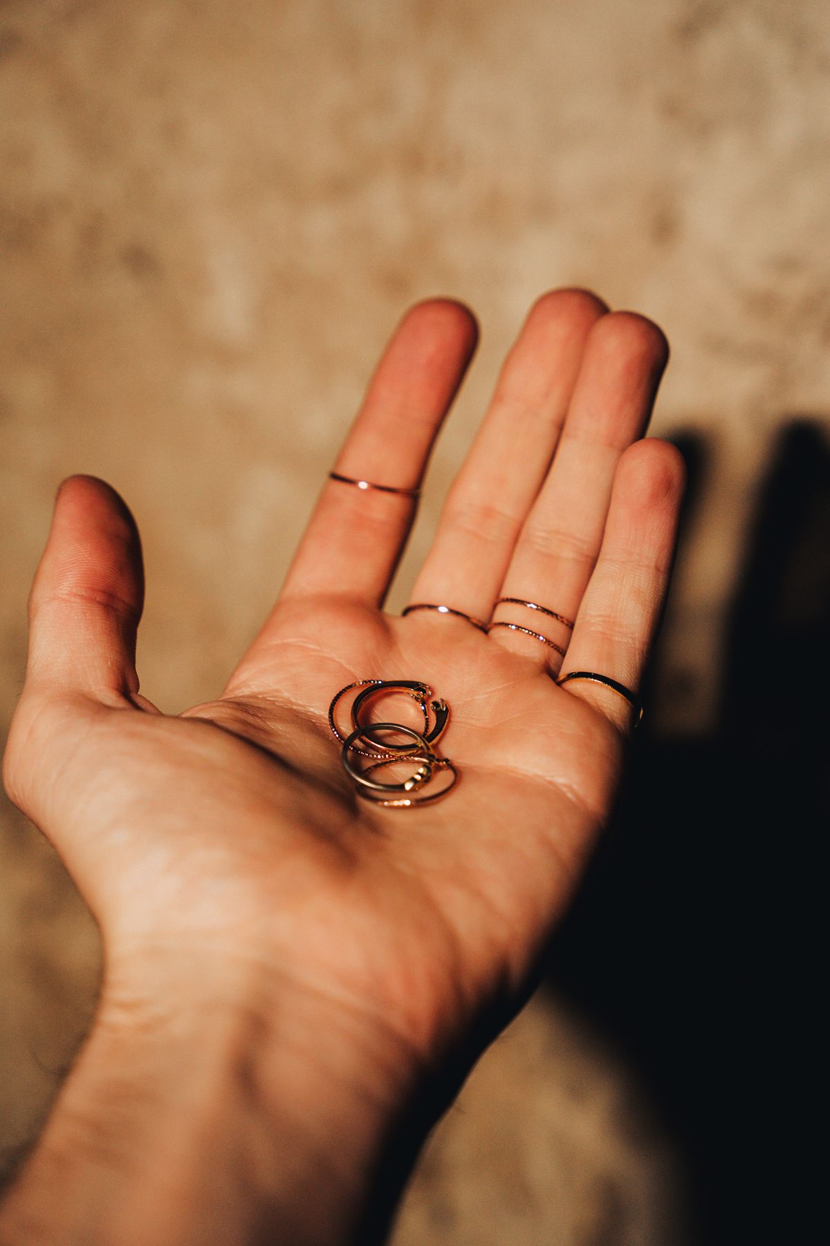 Alternate gold and silver bands on the same hand for an eye-catching, textured look.