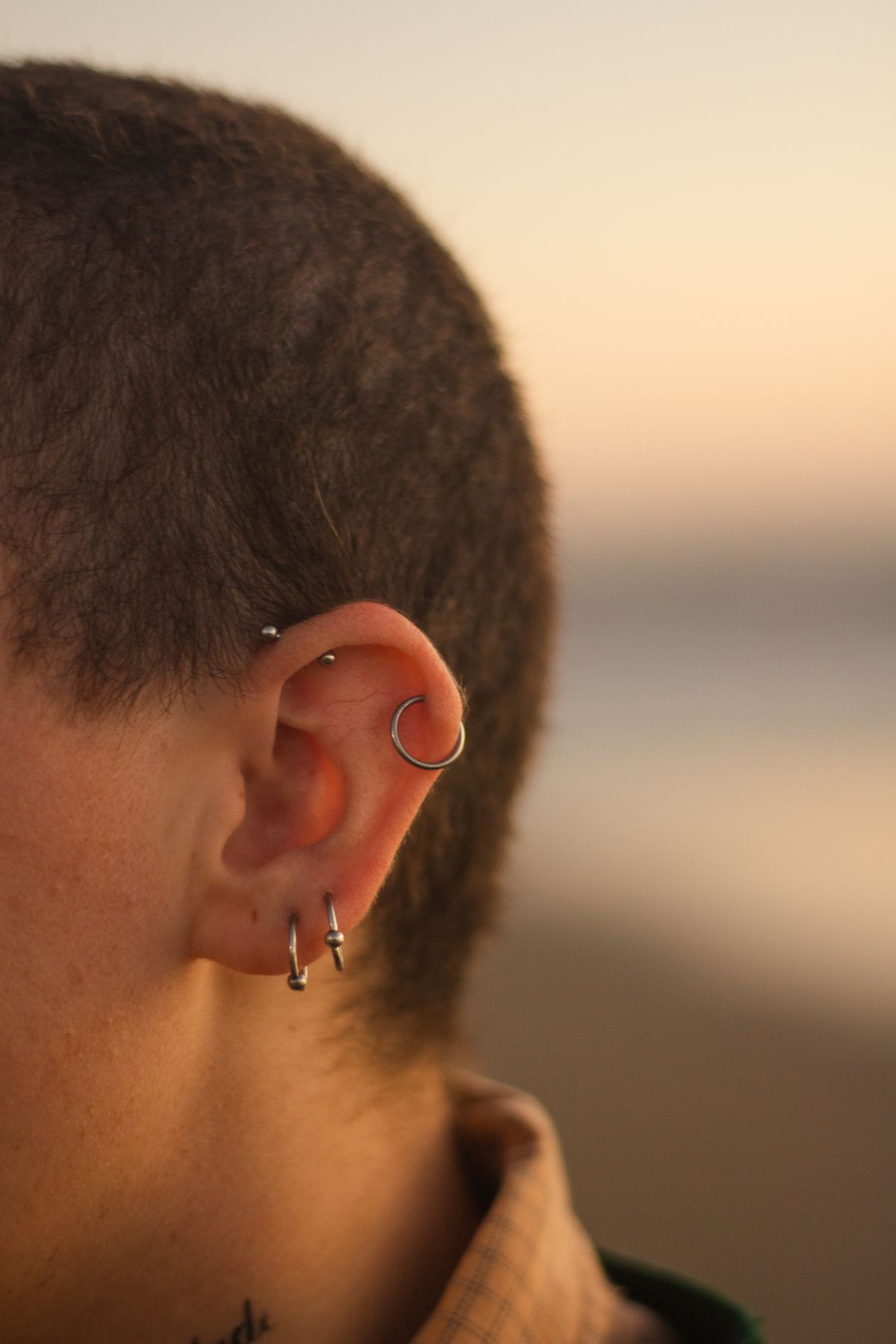 A curated ear stack — cascade from largest at the lobe to smallest at the helix.