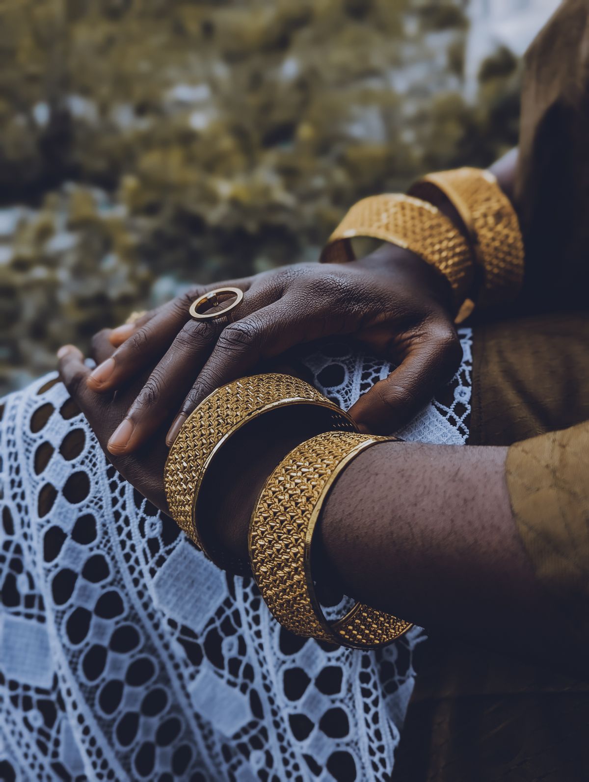 Push up your knit sleeves to reveal a stack of wrist cuffs or a classic tennis bracelet.