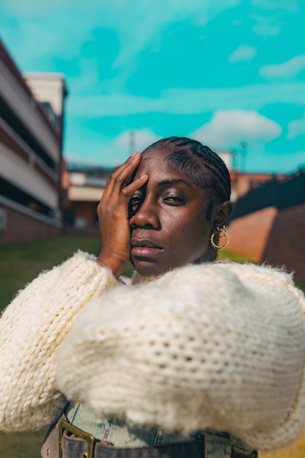 Cozy knitwear pairs beautifully with gold hoops that frame the face.