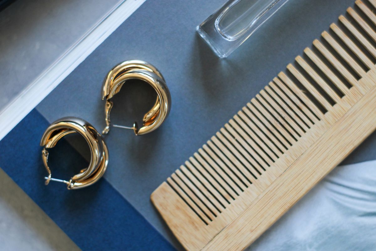 Hypoallergenic huggie hoops provide understated elegance for long workdays and busy commutes.