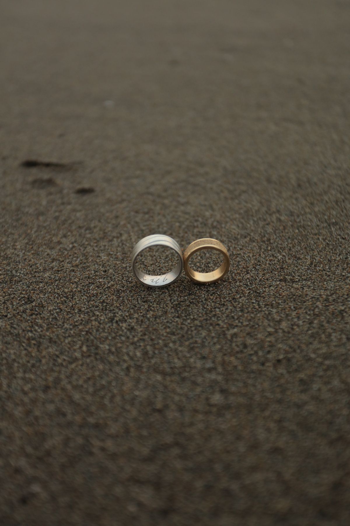 The same design in different metal tones — a secret handshake in plain sight.