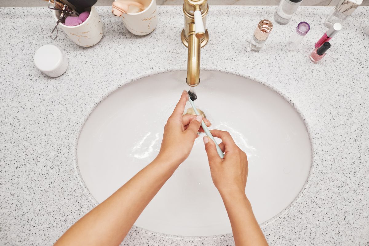 An ultra-soft baby toothbrush reaches dirt behind settings and inside chain links.