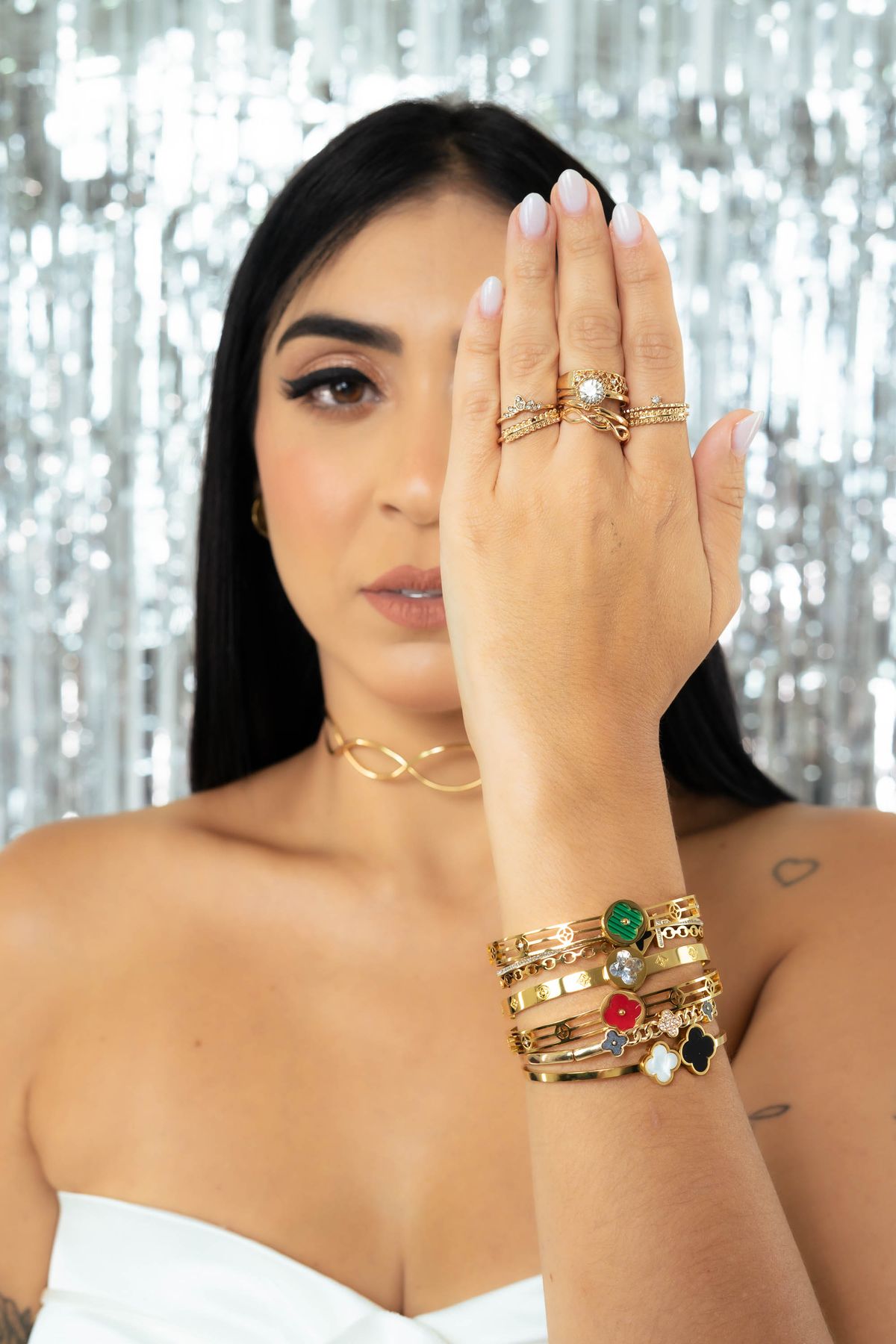 Layering multiplies the dopamine effect — a playful spectrum of gems and sparkle.