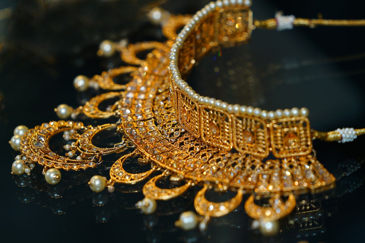 A snug cubic zirconia choker sits directly along the collarbone line.