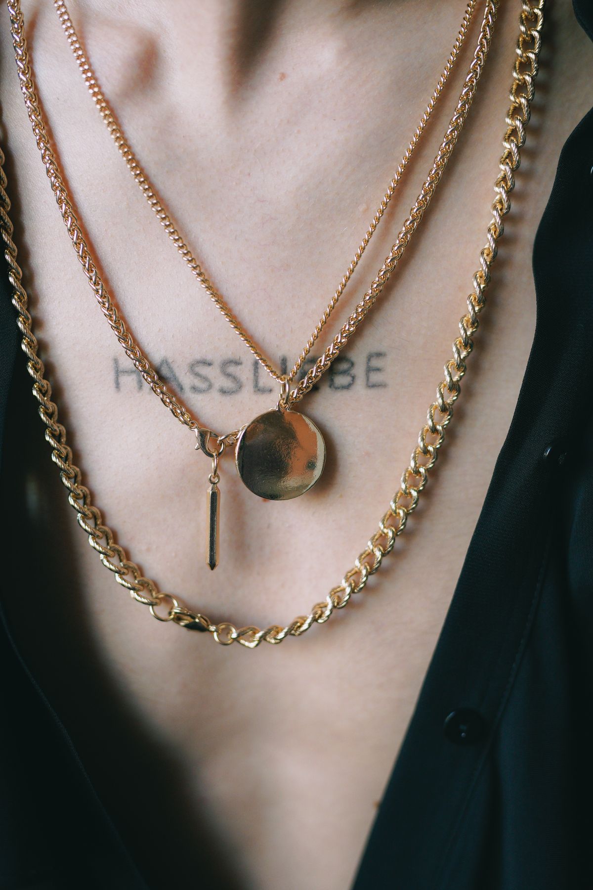 Let the bold chain rest directly against your skin to soften its visual weight.