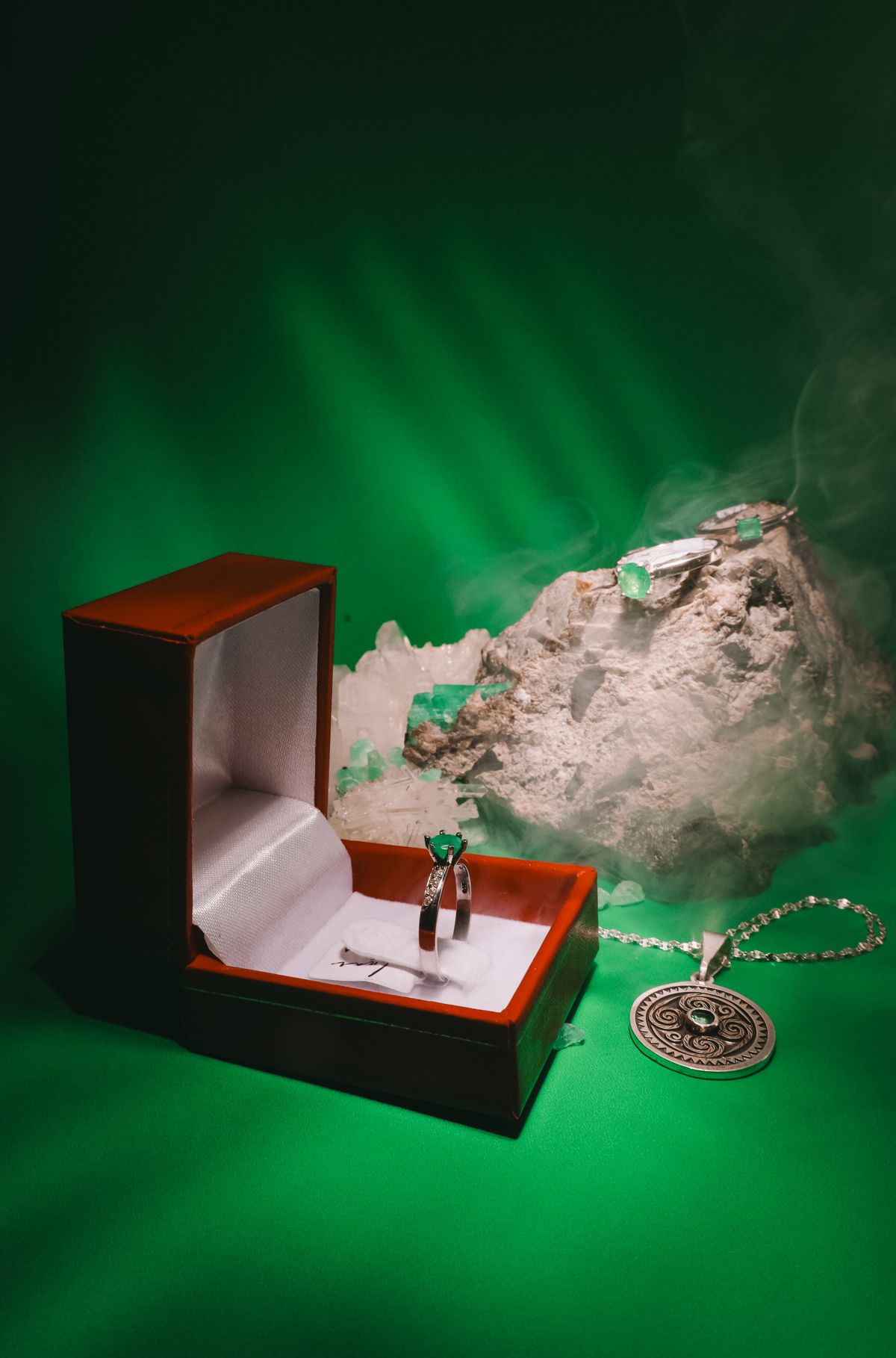 A cool emerald solitaire necklace instantly elevates a gray or navy dress.