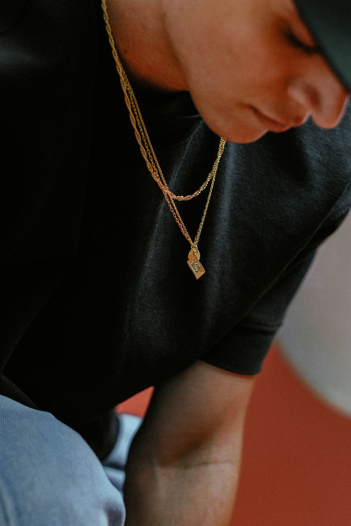 Layer three or four varied chains to compete with a bold graphic print.