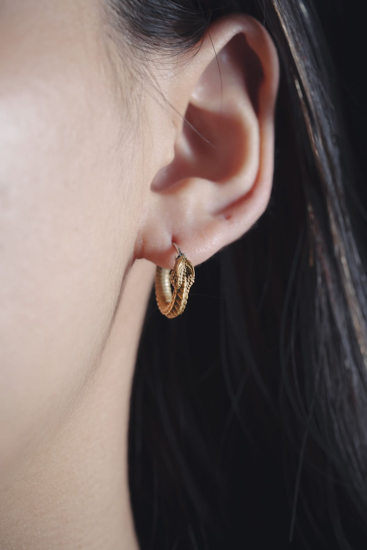 Sleek CZ huggie hoops sit flush against the ear — snag-free elegance for busy days.