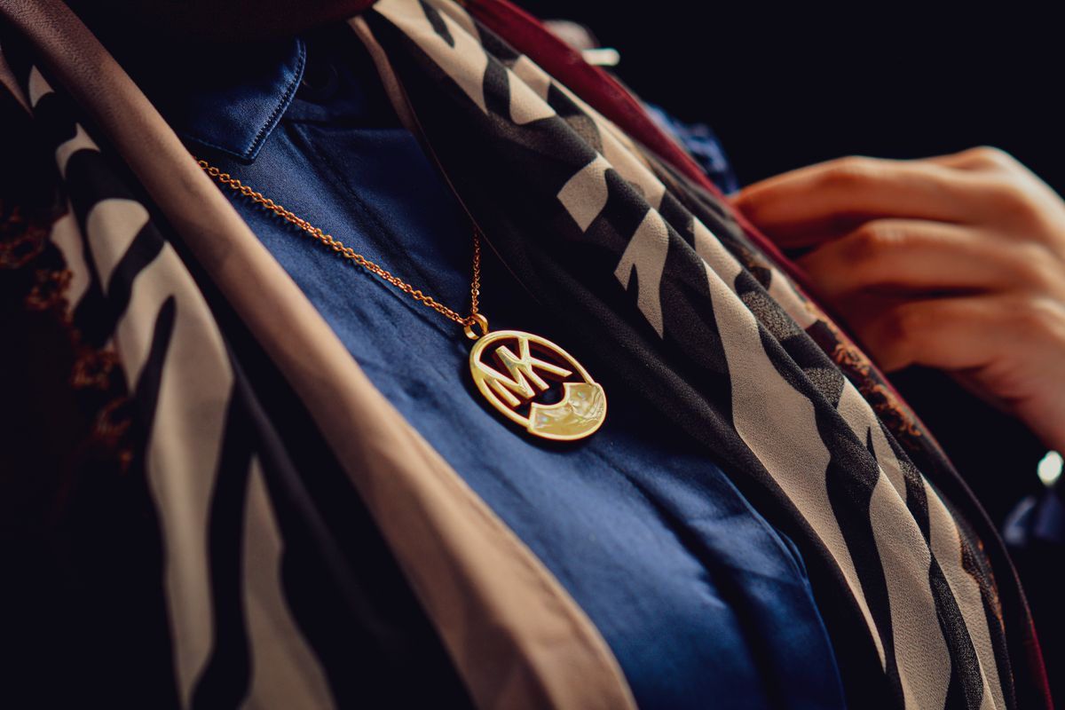 An initial pendant worn daily turns a simple accessory into a cherished touchstone.